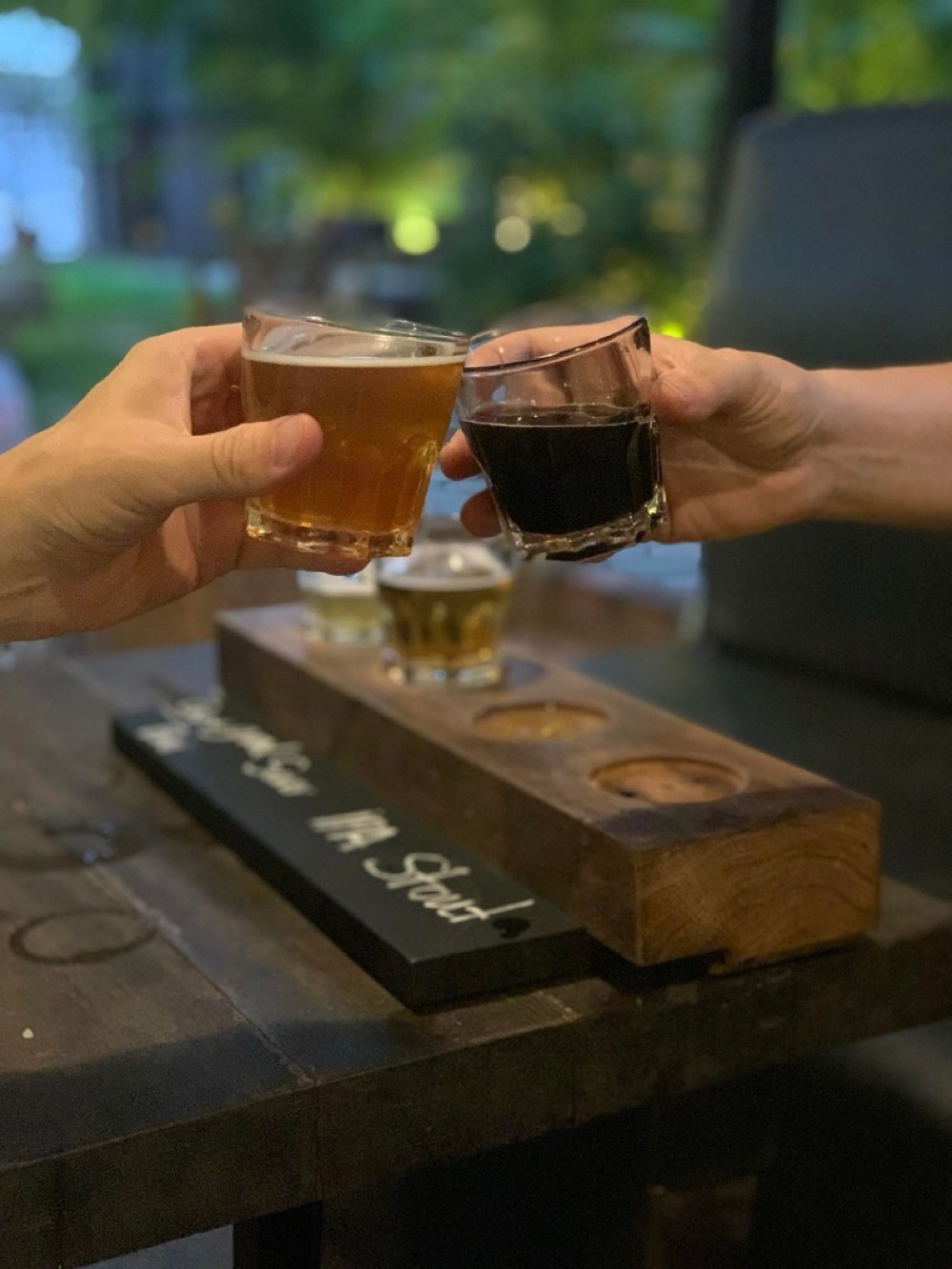 A flight of craft beer brewed at Pomme